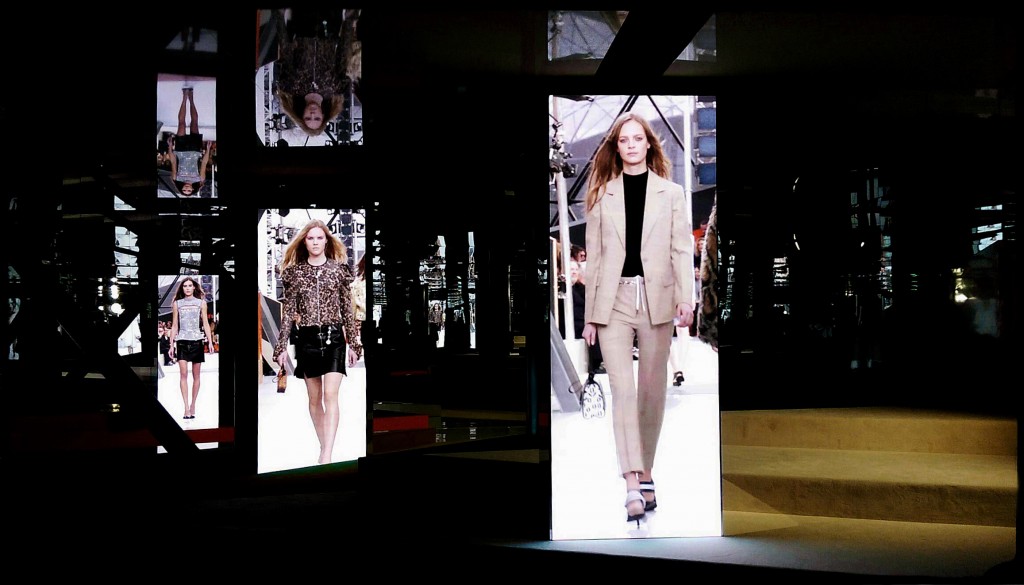 video screens relay the A/W 15/16 collection